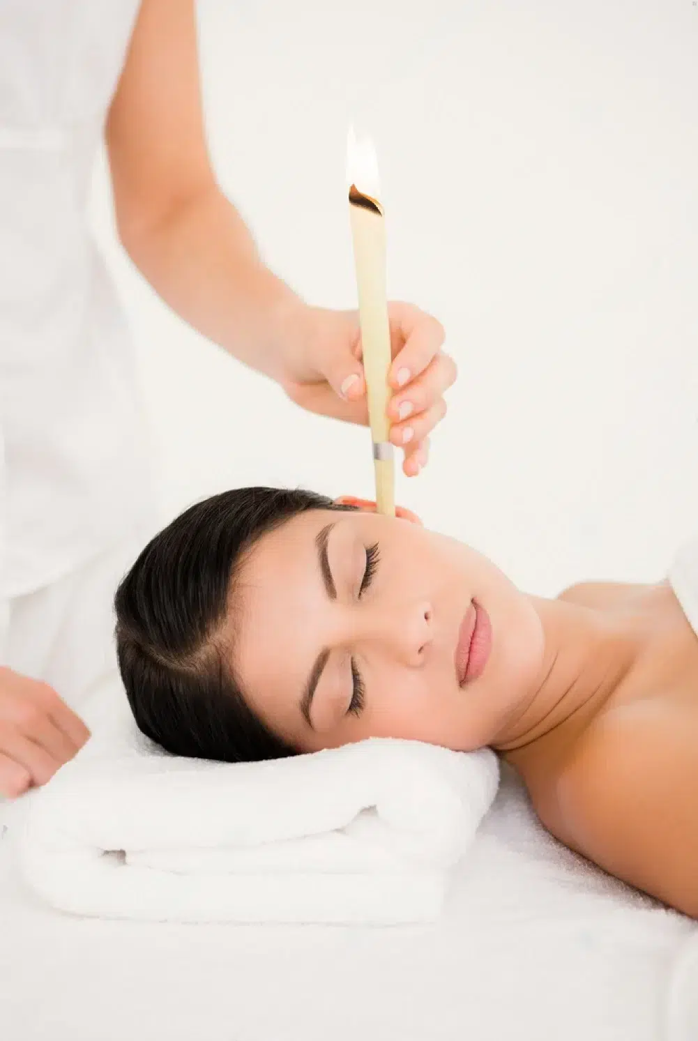 stock-photo-close-up-of-a-beautiful-woman-receiving-ear-candle-treatment-at-spa-center-303694373-transformed